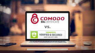 Comodo and GoDaddy SSL certificate logo on an opened laptop