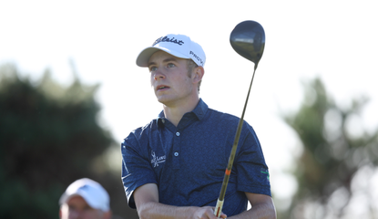 Connor Graham hits a driver off the tee and watches it