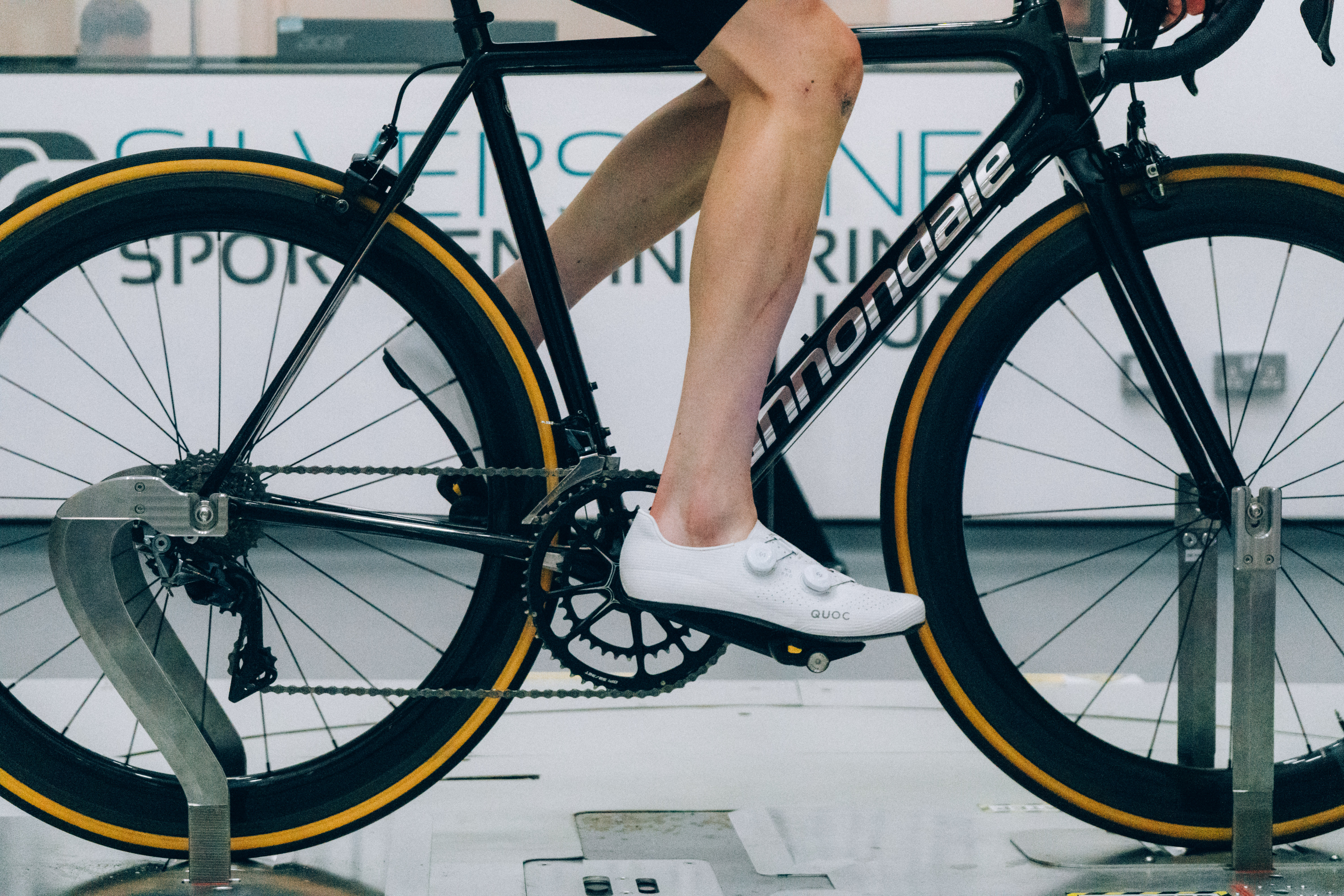A close up of the socks that Tom is wearing while riding a bike in the wind tunnel