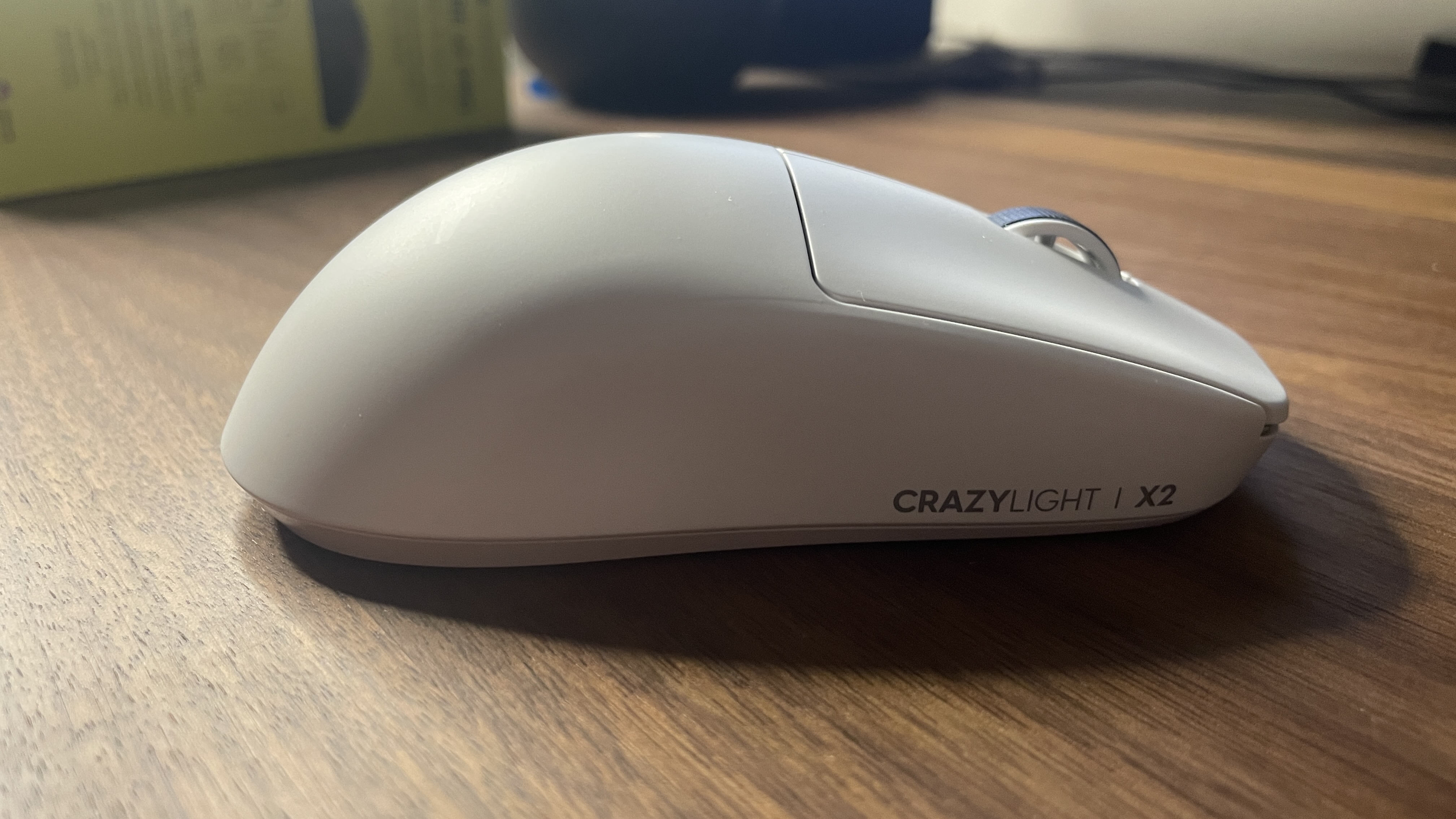 A Pulsar X2 CrazyLight Medium gaming mouse on a desk.