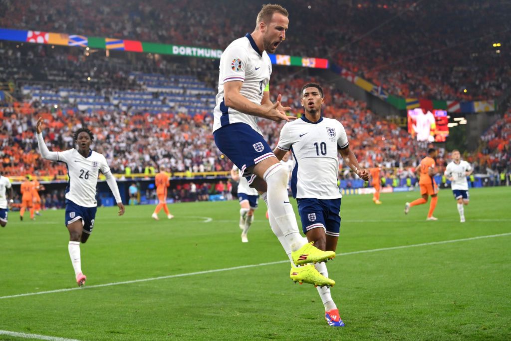 England captain Harry Kane celebrates with his trademark jump after scoring the first England goal from the penalty spot during the UEFA EURO 2024 semi-final match between Netherlands and England 