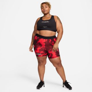 Model wearing a sports bra and Nike biker shorts from Megan Thee Stallion's "Hot Girl Systems" collab with Nike