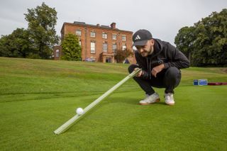 Dan Parker conducting a green speed test using a stimp meter