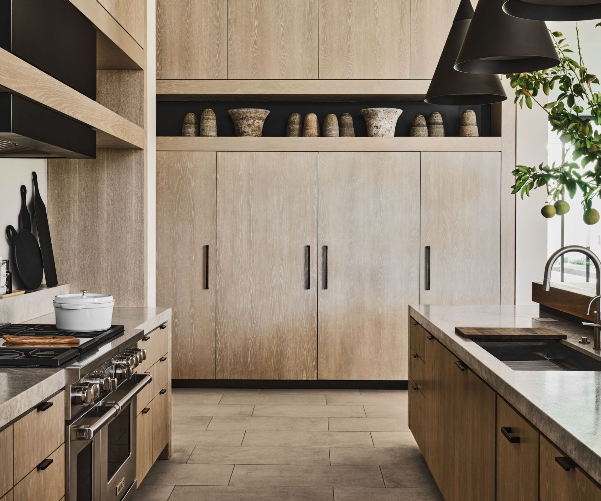 Wood kitchen in the minimalist style with pottery and pendant lights