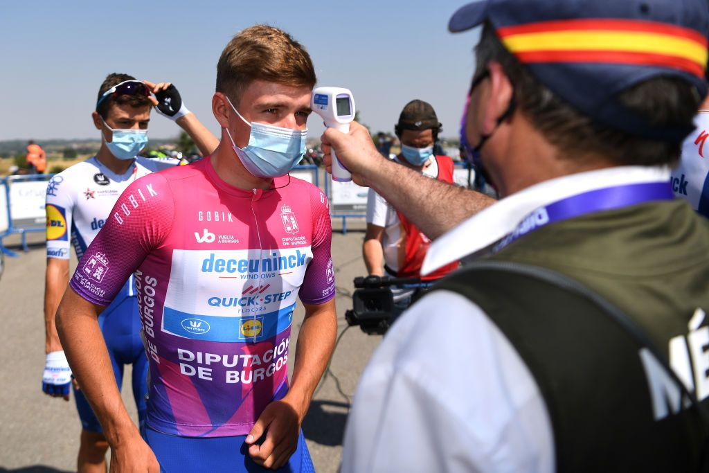 Vuelta a Burgos race leader Remco Evenepoel has his temperature checked before the start
