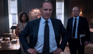 No Time To Die Naomie Harris, Ralph Fiennes, and Rory Kinnear standing in M's office