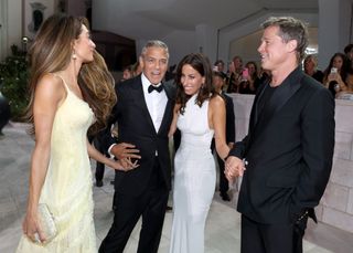 Amal Clooney, George Clooney, Ines de Ramon and Brad Pitt attend the "Wolfs" red carpet on September 01, 2024.