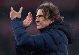 Brentford manager Thomas Frank applauds the fans after the Premier League match between Liverpool FC and Brentford FC at Anfield on November 12, 2023 in Liverpool, England.