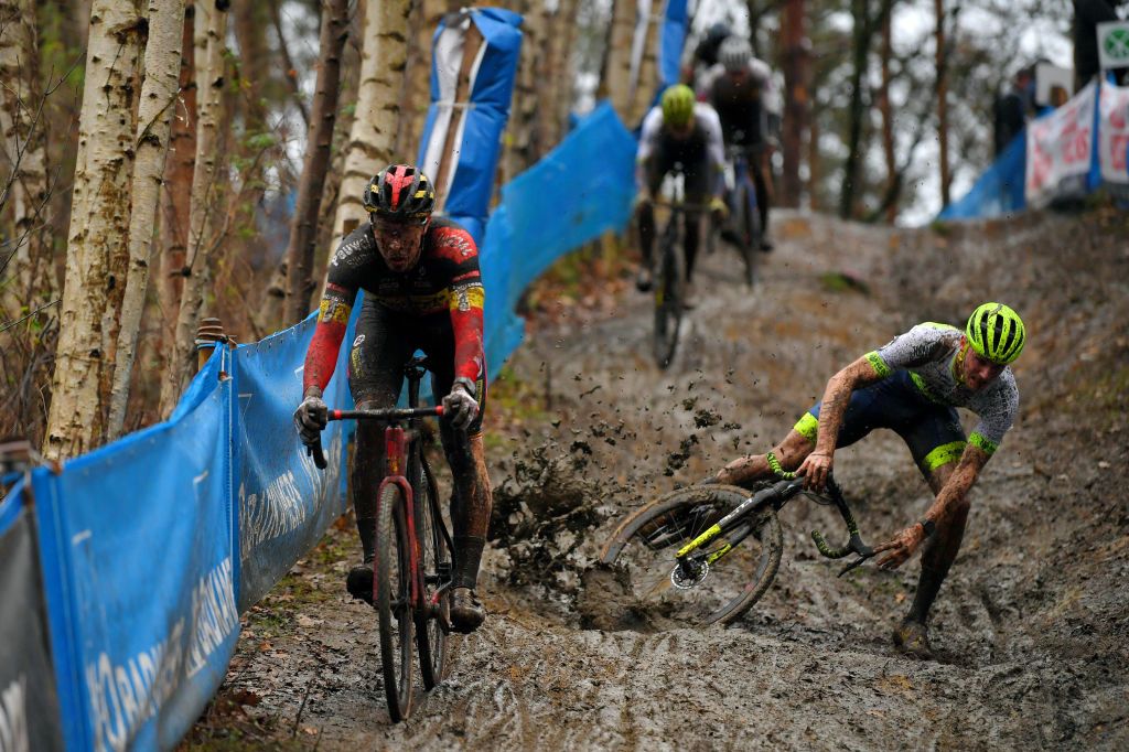 HERENTALS BELGIUM DECEMBER 23 Laurens Sweeck of Belgium and Team Pauwels Sauzen Bingoal Corne Van Kessel of The Netherlands and Tormans Cyclo Cross Team Mud during the 37th Herentals Azencross 2020 Men Elite CX DVVTrofee Azencross on December 23 2020 in Herentals Belgium Photo by Luc ClaessenGetty Images