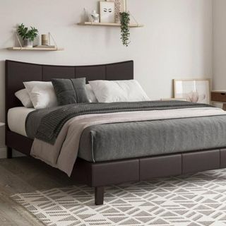 faux leather bed frame in white bedroom