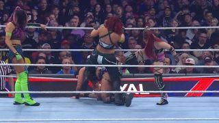 Damage CTRL beating down Rhea Ripley at the 2023 Royal Rumble