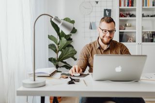Man Using Macbook in home office