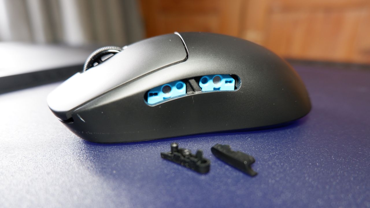A Logitech G Pro wirless gaming mouse on a mouse pad