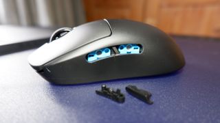 A Logitech G Pro wirless gaming mouse on a mouse pad