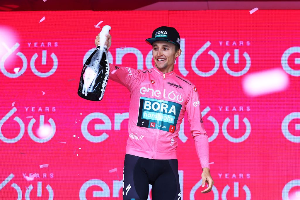 PASSO FEDAIA ITALY MAY 28 Jai Hindley of Australia and Team Bora Hansgrohe celebrates at podium as Pink Leader Jersey winner during the 105th Giro dItalia 2022 Stage 20 a 168km stage from Belluno to Marmolada Passo Fedaia 2052m Giro WorldTour on May 28 2022 in Passo Fedaia Italy Photo by Michael SteeleGetty Images