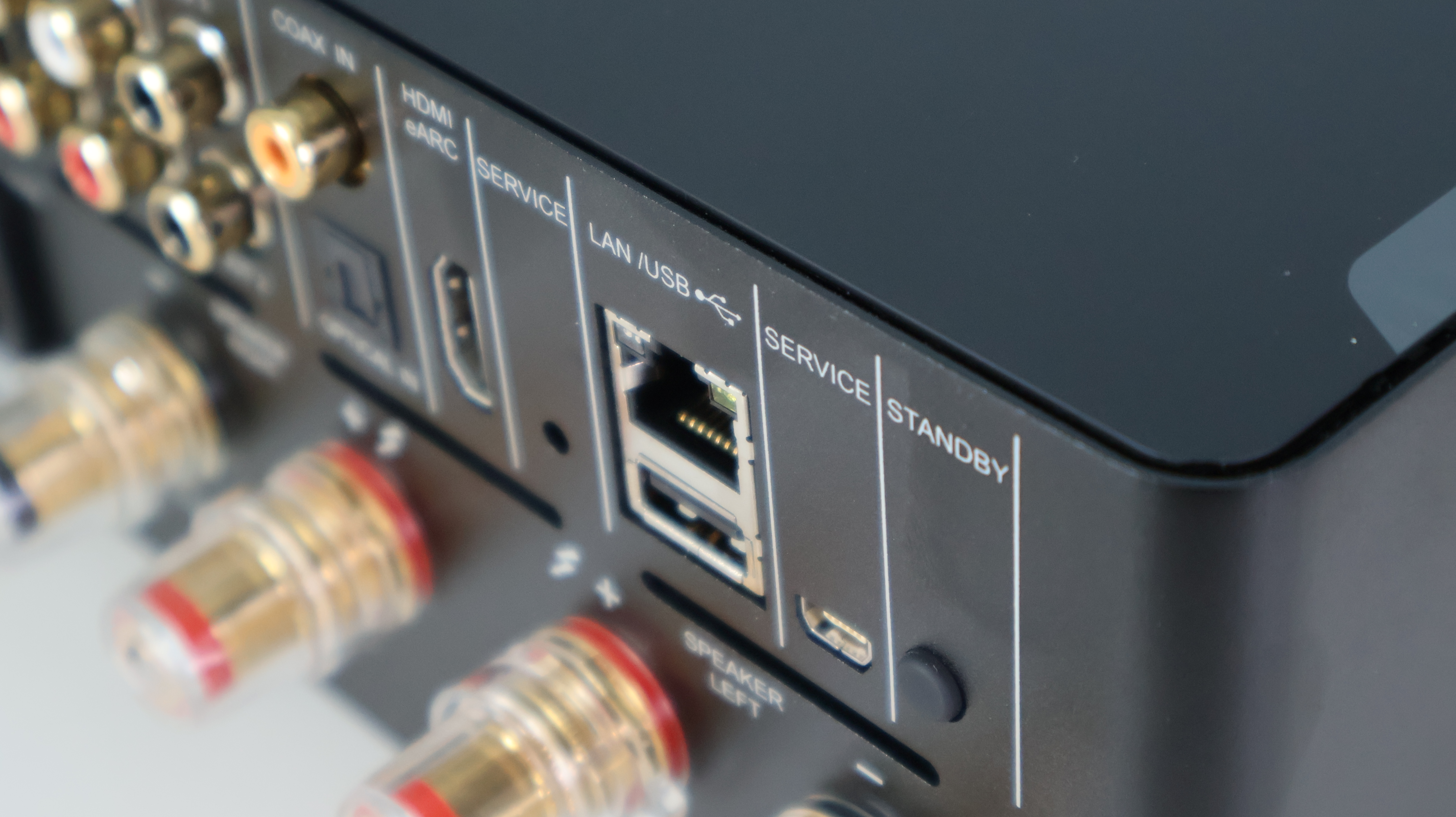 NAD M10 V3 showing the cable connection points, with LAN/USB port in focus