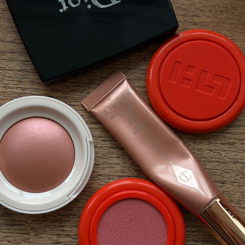 A photo of shimmery blushers on table