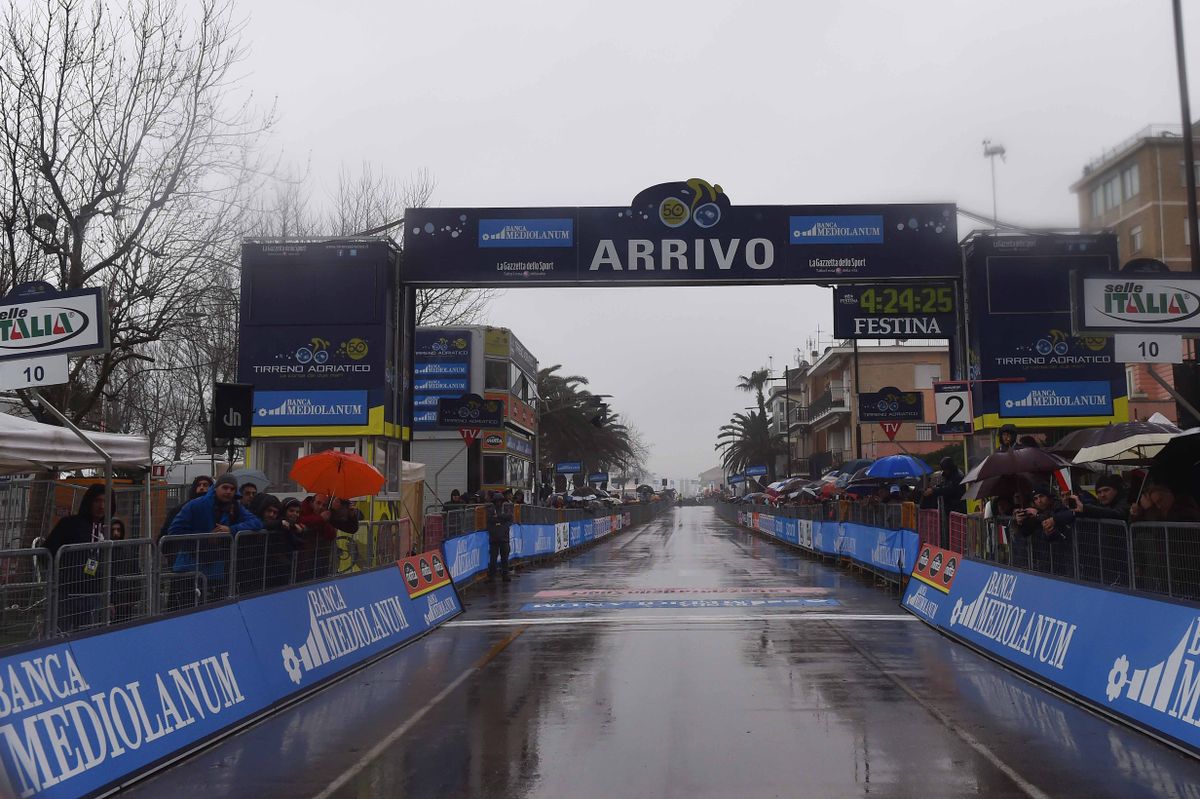 The wet finish line awaits the peloton
