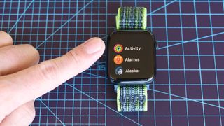 Close-up of the Apple Watch SE 2022 and Apple's Activity app where you can now pause Rings