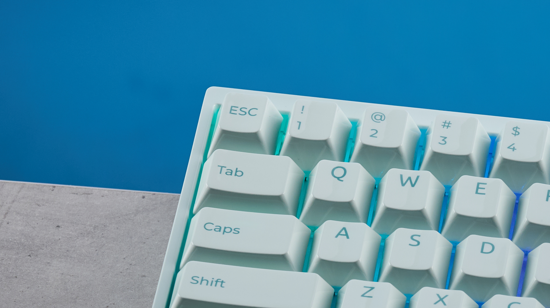 The Keychron Q16 HE 8K in light green on a stone surface