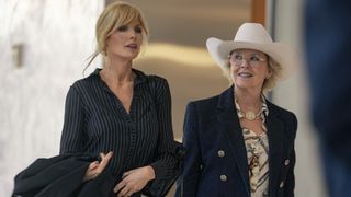 (L-R): Kelly Reilly as Beth Dutton and Annette Bening as Beulah Jackson walking together in Dutton Ranch. 