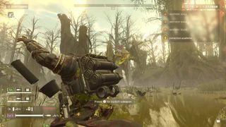 Helldivers 2 helldivers reloading recoilless rifle in front of bile titan