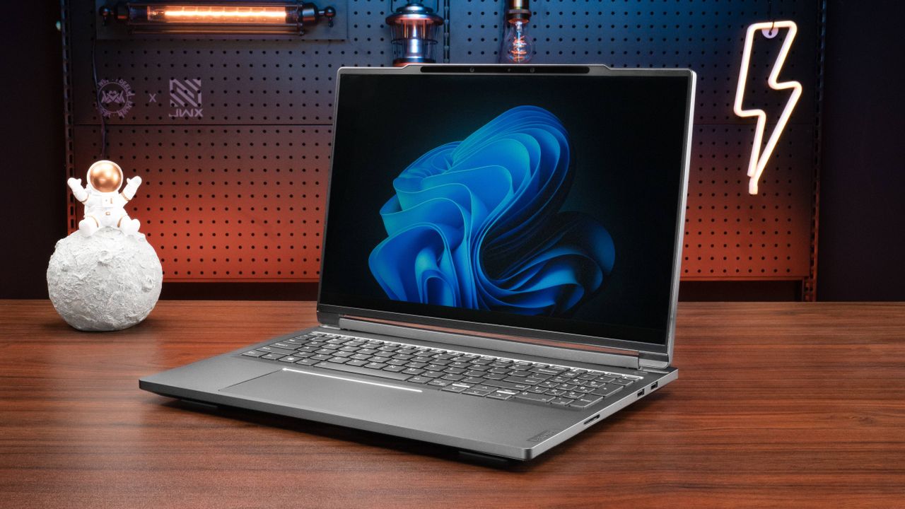 Lenovo ThinkBook 3D Laptop Concept on table next to astronaut on moon model