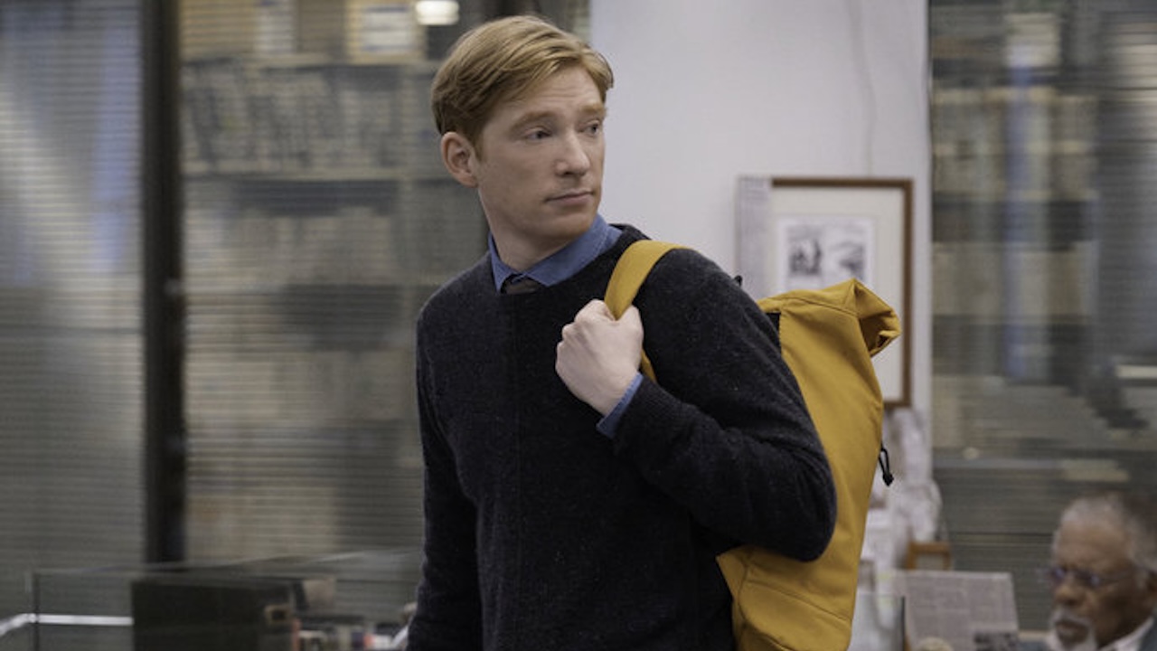 Domhnall Gleeson as Ned Sampson wearing his backpack in The Paper Season 1x01