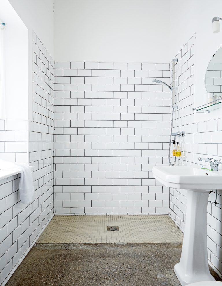 small bathroom ideas wet room with concrete floor and metro tiles on wall