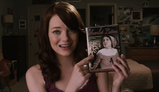 Emma Stone holding up Scarlet Letter in Easy A