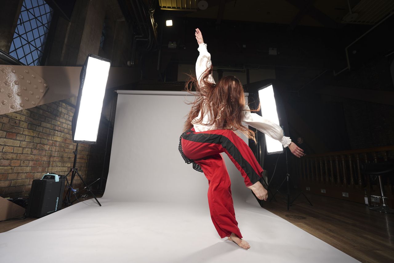 Sony A7 V sample images &ndash; dancer's movement frozen, with background roll and lights included in the frame