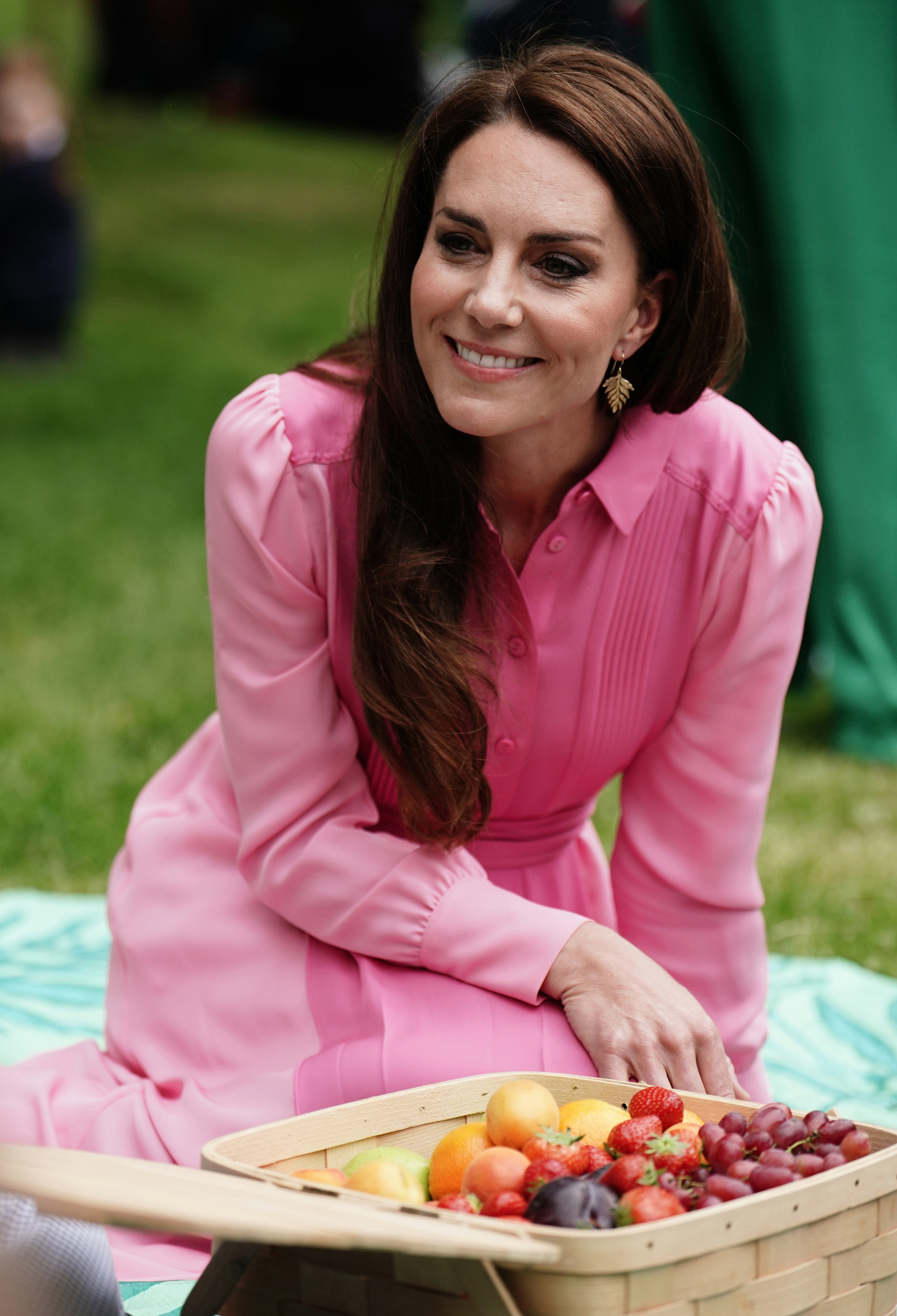 LONDON, ENGLAND - MAY 22: Catherine, Princess of Wales takes part in the first Children's Picnic at the RHS Chelsea Flower Show, at the Royal Hospital Chelsea on May 22, 2023 in London, England. Ten schools from the Royal Horticultural Society's (RHS) Campaign for School Gardening were invited to bring pupils along to the RHS Chelsea Flower Show, marking the first time in the event's 110-year history that a Children's Picnic has taken place. (Photo by Jordan Pettitt-WPA Pool/Getty Images)