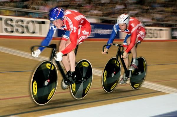 David Daniell (Great Britain) leads out team mate Matt Crampton on the second lap of the team sprint