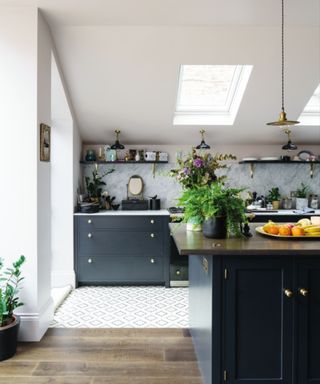 white kitchen with black cabinets and island