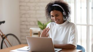 Woman waving on video call