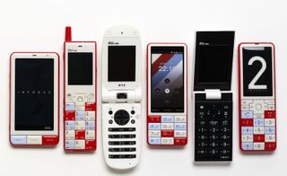 Six mobile phones in different sizes and colours.