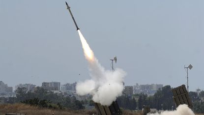 A missile is launched by an 'Iron Dome' battery in the Gaza strip