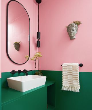 colors that go with light pink, green and pink bathroom, black mirror, faucet and pendant light, white basin, ornament on wall