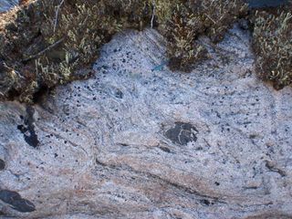 A close-up of 2.7 billion-year-old granite from the Hudson Bay. These rocks are apparently the second generation of rocks on Earth: Their parent rock was around 4.3 billion years old.