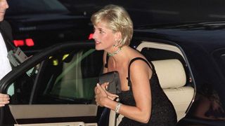 Princess Diana getting out of a car holding a clutch bag