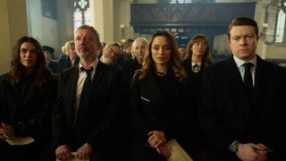 Gray Wright, Georgia Wright and John Wright sitting in a row at the funeral