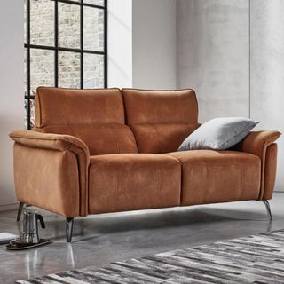 A tan sofa in a grey living room