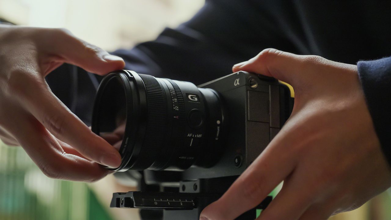 The Sony FE 16mm f/1.8 G used by a person