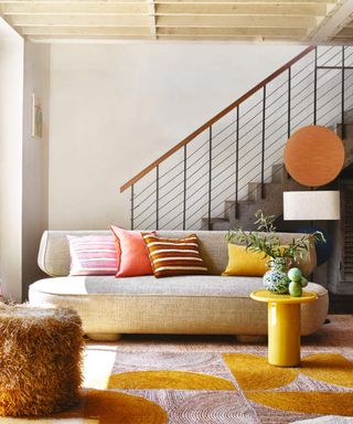 Coloful rug, stairs, sofa