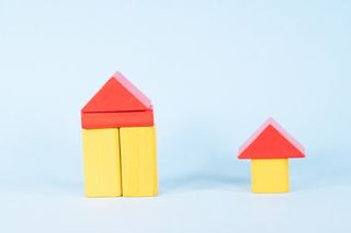 large house and smaller house made of yellow and red blocks