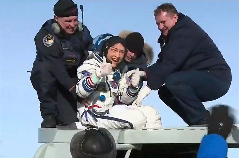 NASA astronaut Christina Koch, newly back on Earth after a record 328 days in space, gives a &quot;thumbs up&quot; upon exiting the Soyuz MS-13 spacecraft on the Kazakh steppe on Feb. 6, 2020. 