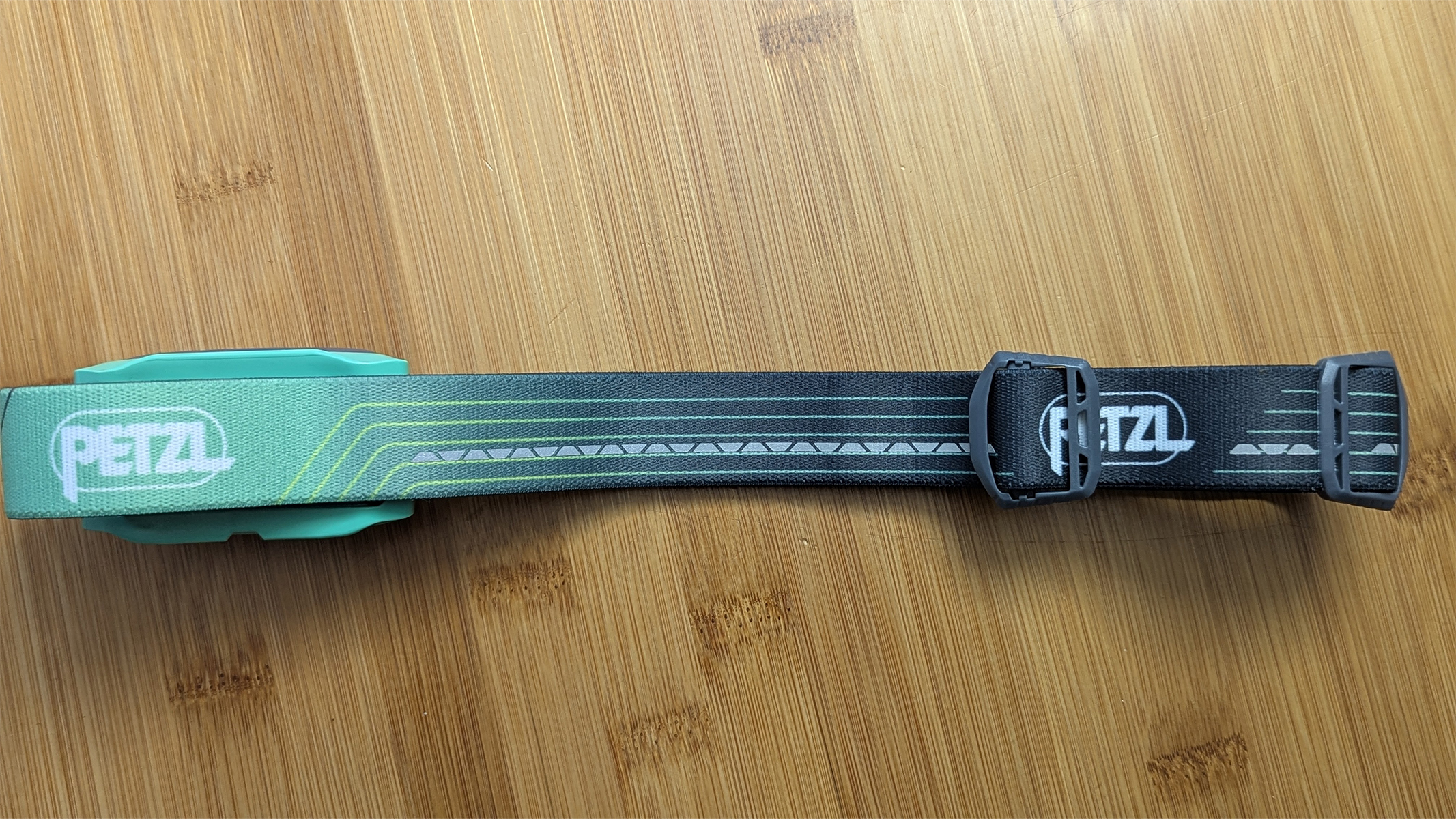 The Tikka Core headband laid out on a wooden table