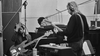 American musician Duane Allman (1946 - 1971), American bass guitarist Jerry Jemmott, with American singer, songwriter, pianist, and civil rights activist Aretha Franklin (1942 - 2018) at the piano during the recording session of Aretha Franklin's studio version of song 'The Weight' which was included in Franklin's album 'This Girl's in Love with You' at Atlantic Studios, New York City, US, 9th January 1969.