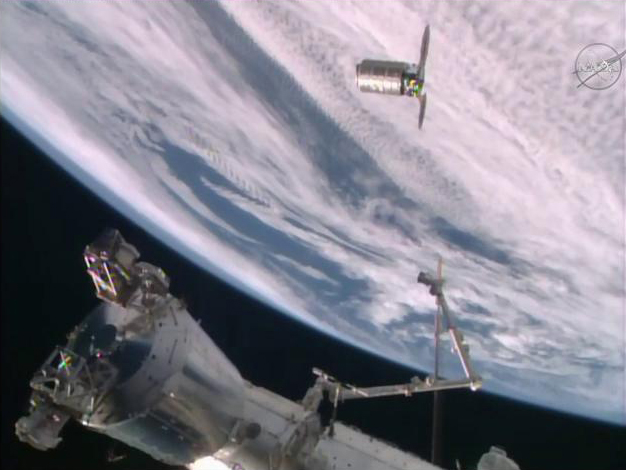 An unmanned Orbital ATK Cygnus spacecraft is seen at the International Space Station on Dec. 9, 2015 just before it is captured by the station&#039;s robotic arm. The spacecraft is carrying nearly 4 tons of supplies for the station&#039;s crew.