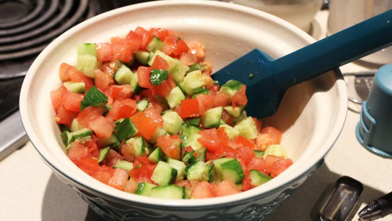 Breville Paradice 16 Food Processor chopped salad with tomato and cucumber in a bowl
